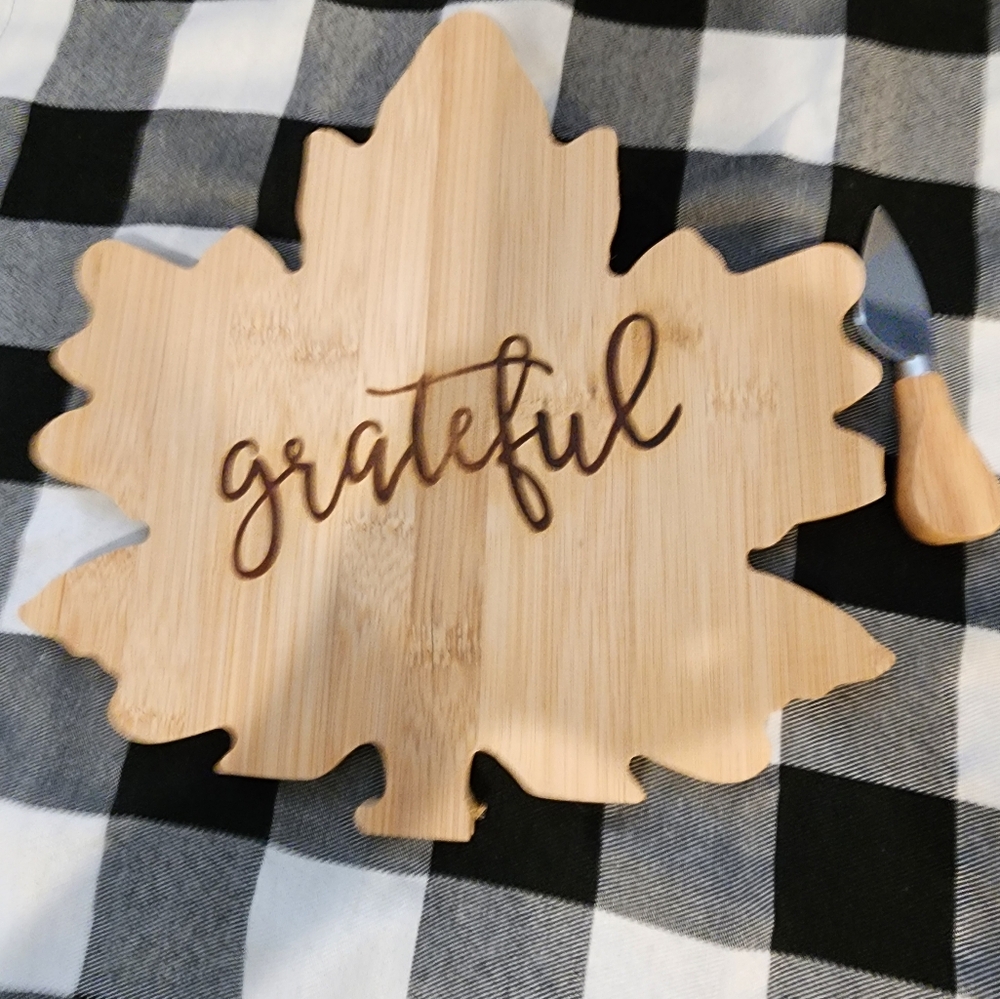 Leaf shaped wood charcuterie board and serving knife